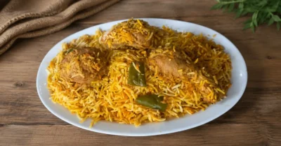 Fanoosh Chicken Biryani served on white plate with aromatic basmati rice, tender chicken, and authentic spices for rich flavor